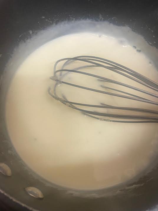 Thickened white sauce in pot