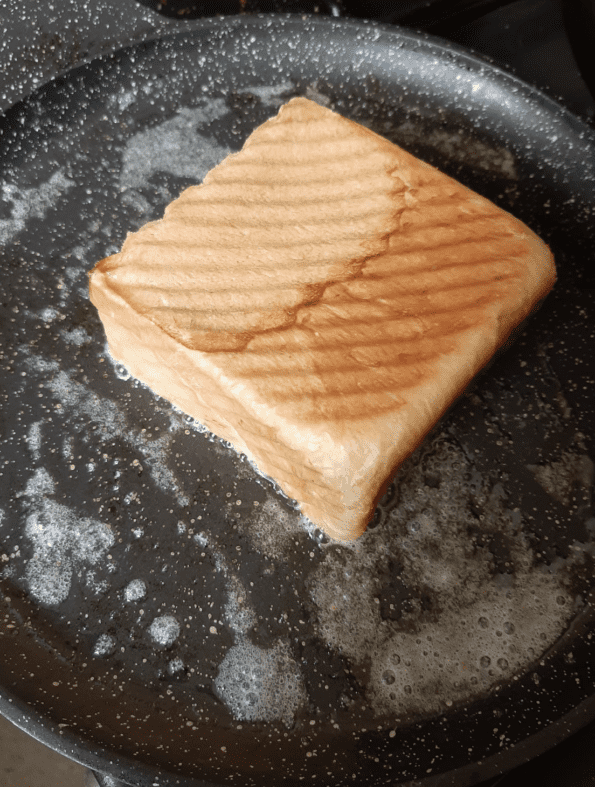 Shokupan being toasted in pan