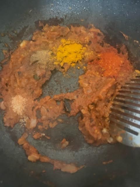 Spices added to masala in wok