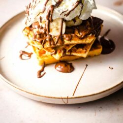 Nutella Waffles with cream and nutella in plate