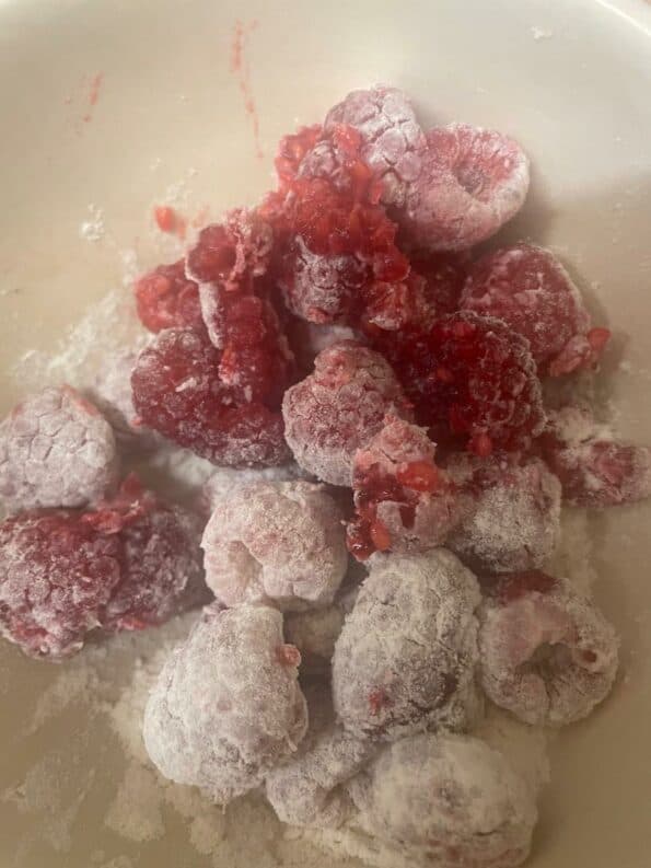 Raspberries and flour in a bowl