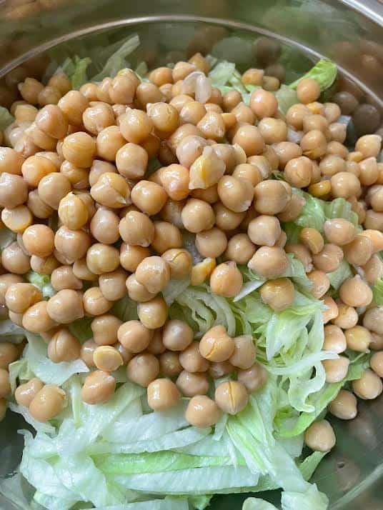Chickpeas added to bowl