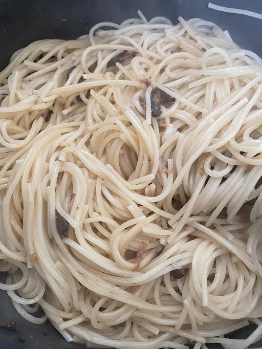 Spaghetti added to pot