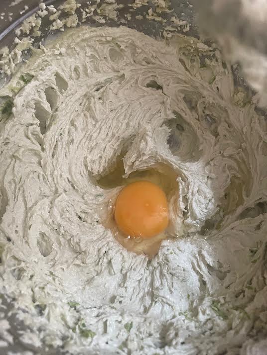 Egg added to batter in bowl