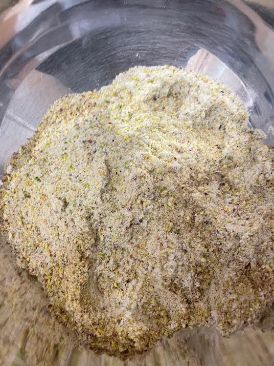 Flour and Ground Pistachios mixed in a bowl