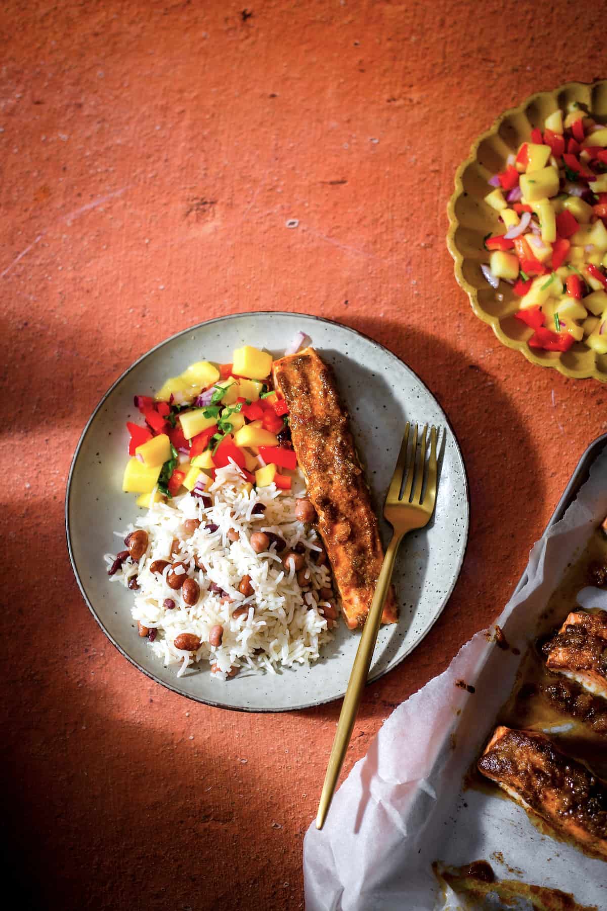 Jerk and Honey Salmon with Rice and Mango Salsa in plate