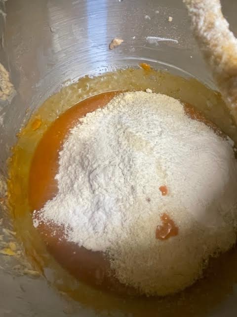 Dry ingredients added to Pumpkin batter in bowl