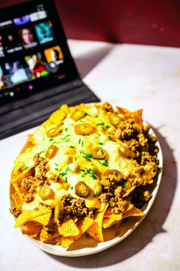 Nachos with ipad in back showing movies