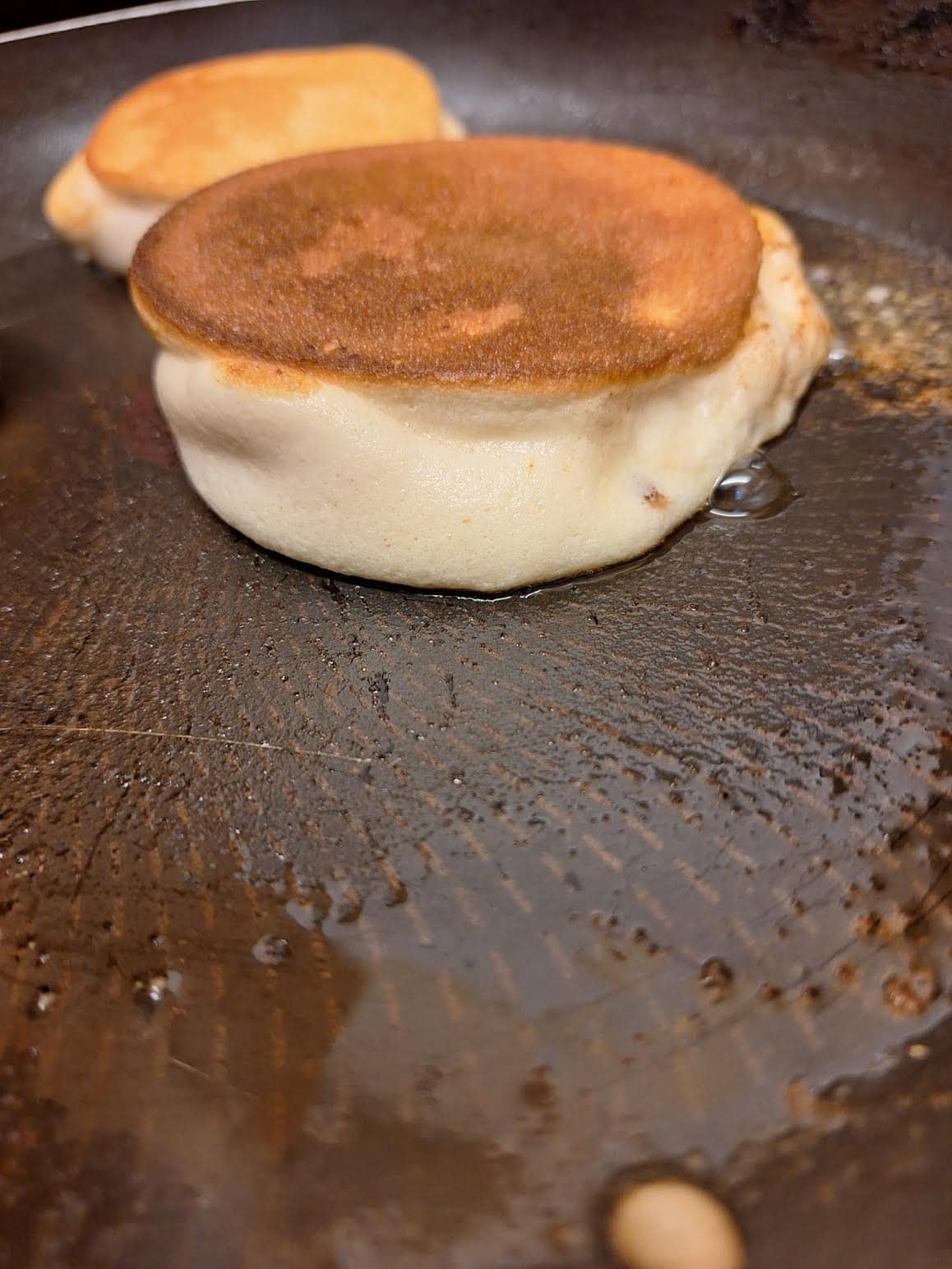 Flipped pancakes in pan