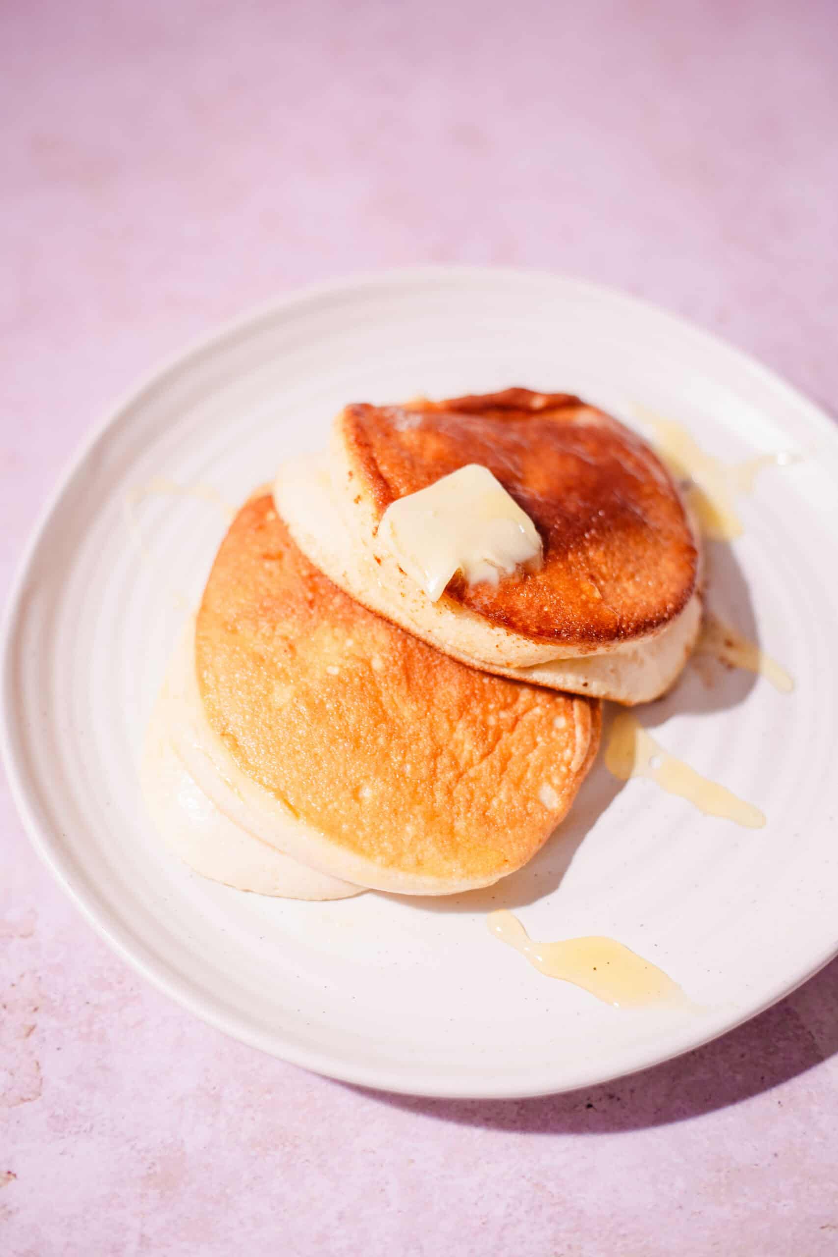 Plain pancakes with butter on plate
