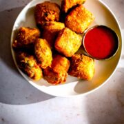 Paneer Pakora in a plate with sauce