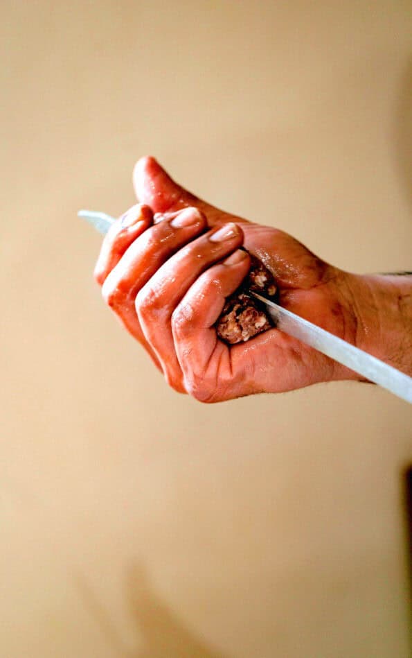 Kebab Meat being added to skewer