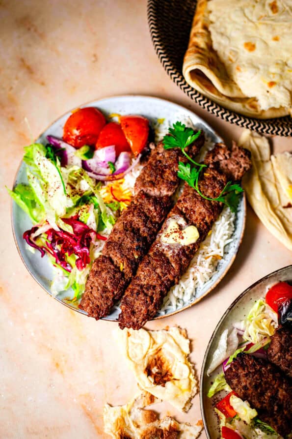 Kebab Koobideh with rice and salad in plate