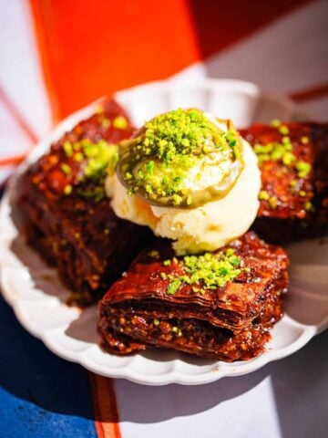 3 pieces of Chocolate Baklava on plate with ice cream