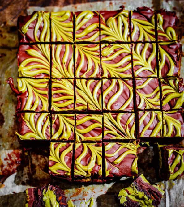 Pistachio Chocolate Brownies with feather design on table