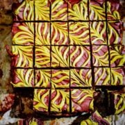 Pistachio Chocolate Brownies with feather design on table