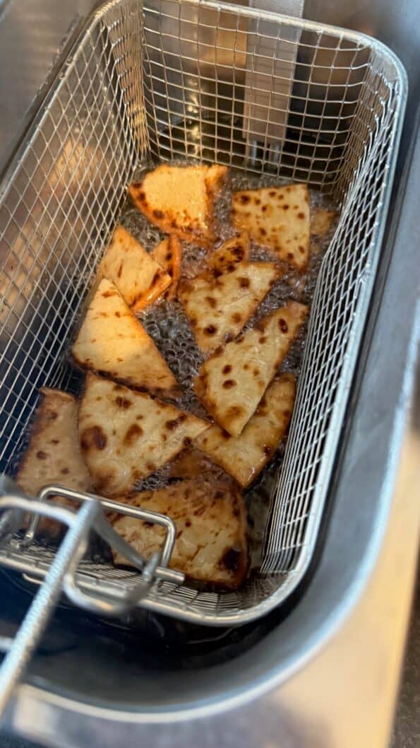 Shorbat Adas - Arabic (Middle Eastern) Lentil Soup Fried pitta chips in fryer