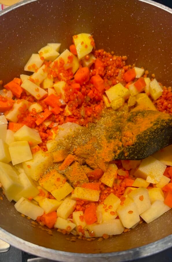 Shorbat Adas - Arabic (Middle Eastern) Lentil Soup Spices added to pot