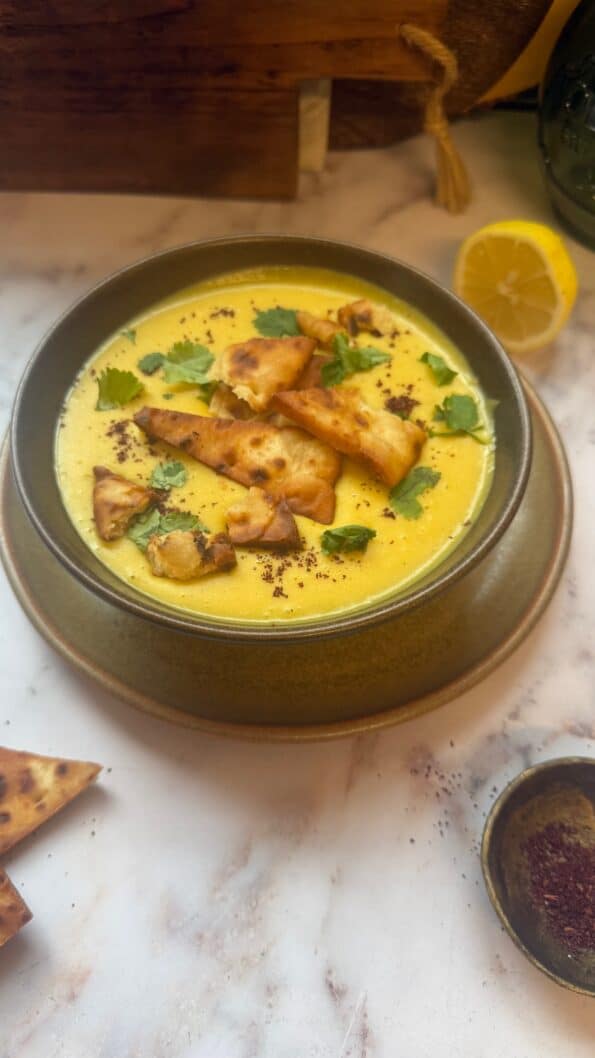 Shorbat Adas - Arabic (Middle Eastern) Lentil Soup Soup with toppings in bowl