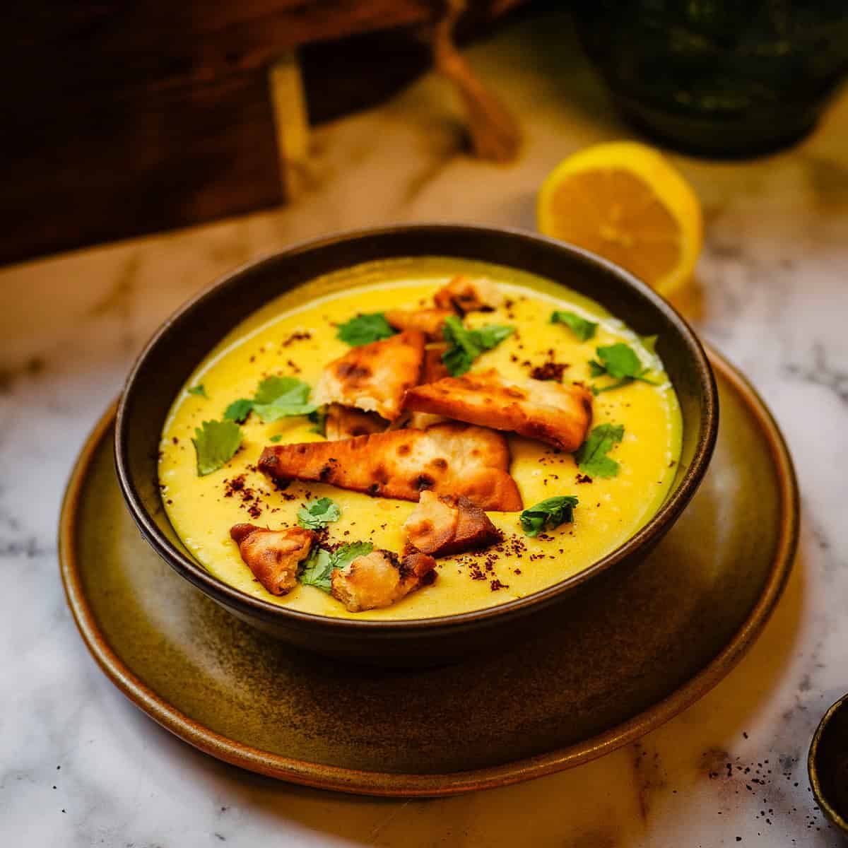 Shorbat Adas - Arabic (Middle Eastern) Lentil Soup Shorbat Adas in bowl with Pitta chips