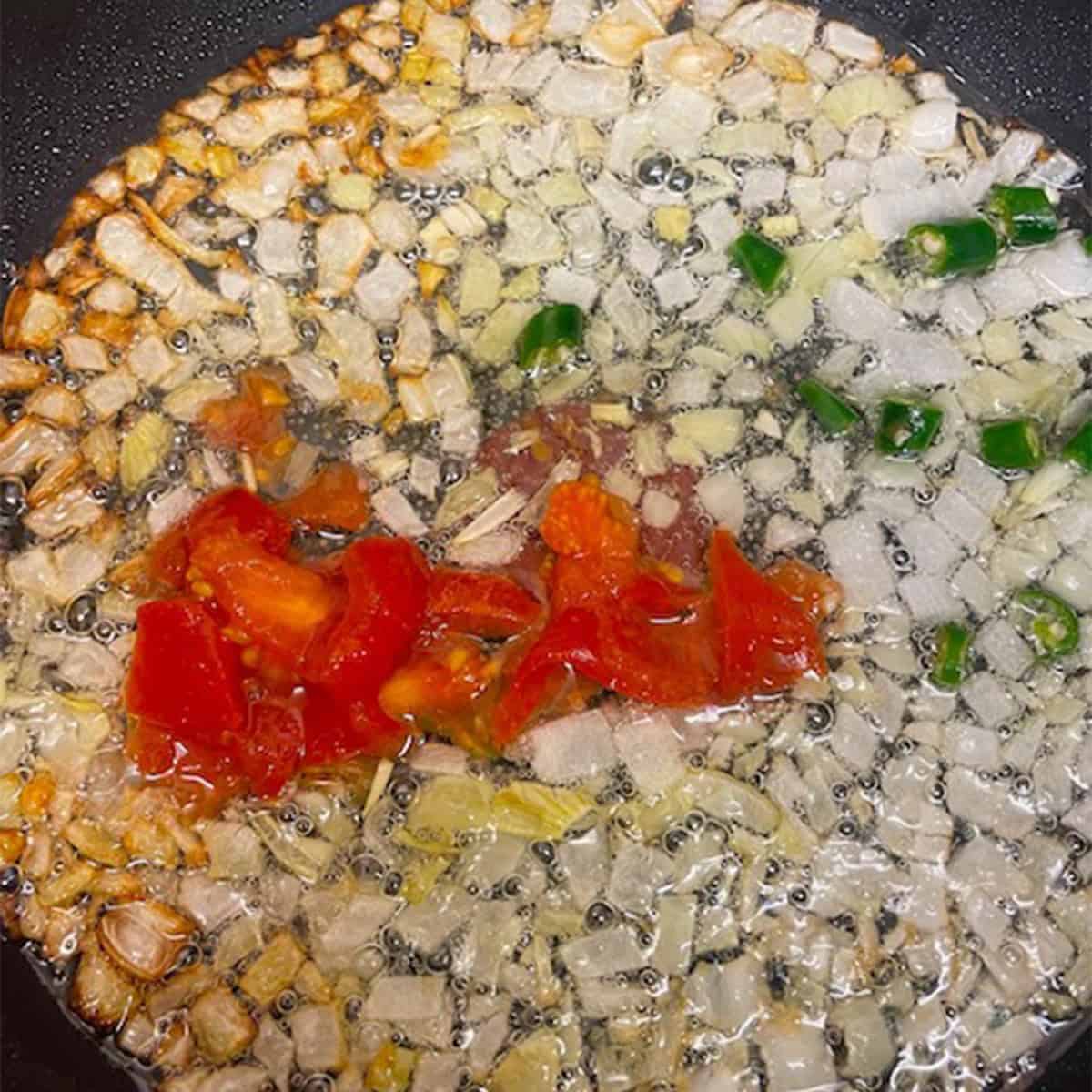 Tomato and Chillies added to pan