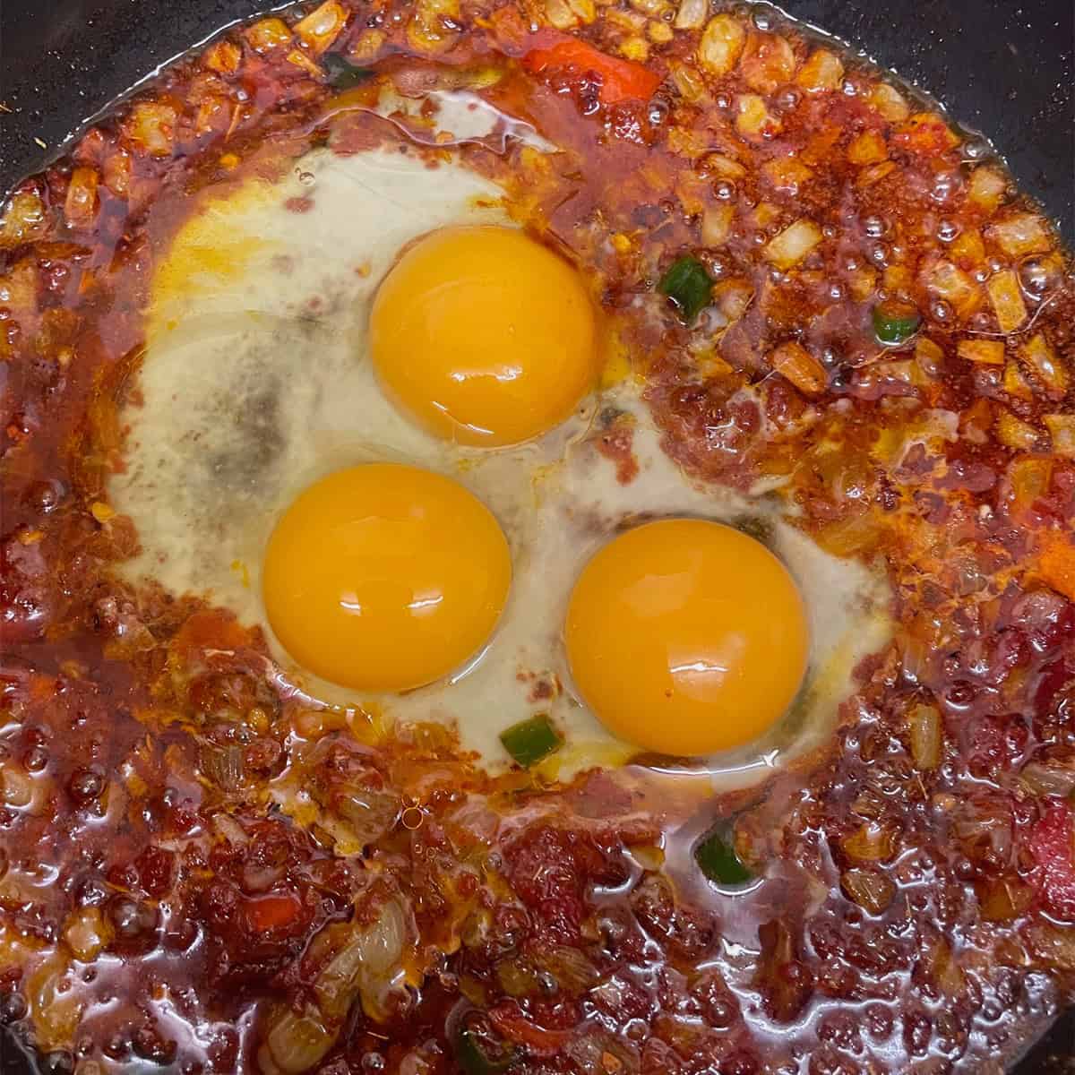 Eggs added to pan