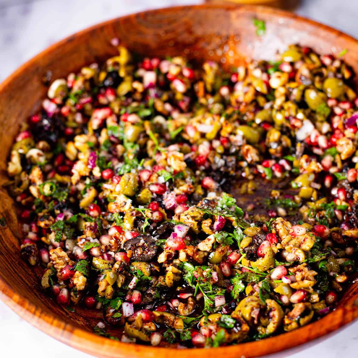Olive, Walnut and Pomegranate Salad Olive, Walnut and Pomegranate Salad in large bowl