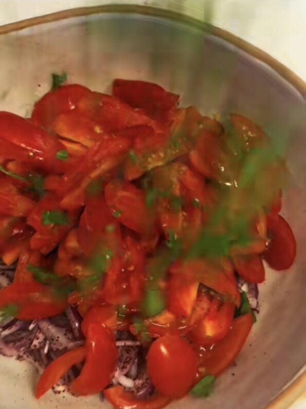 Tomatoes and Parsley added to bowl