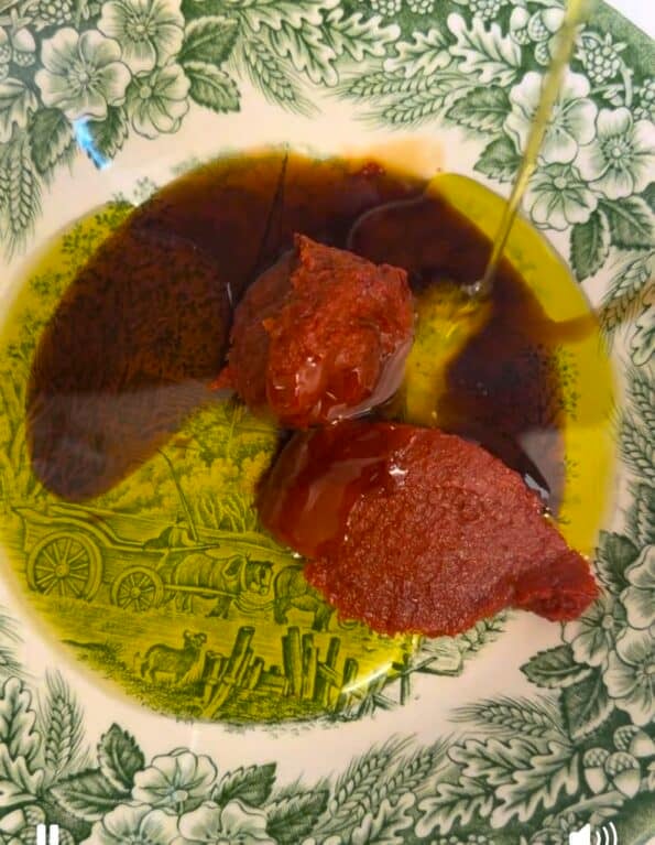 Olive oil and molasses added to bowl