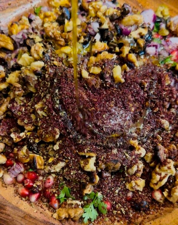 Sumac and Aleppo Pepper added to bowl