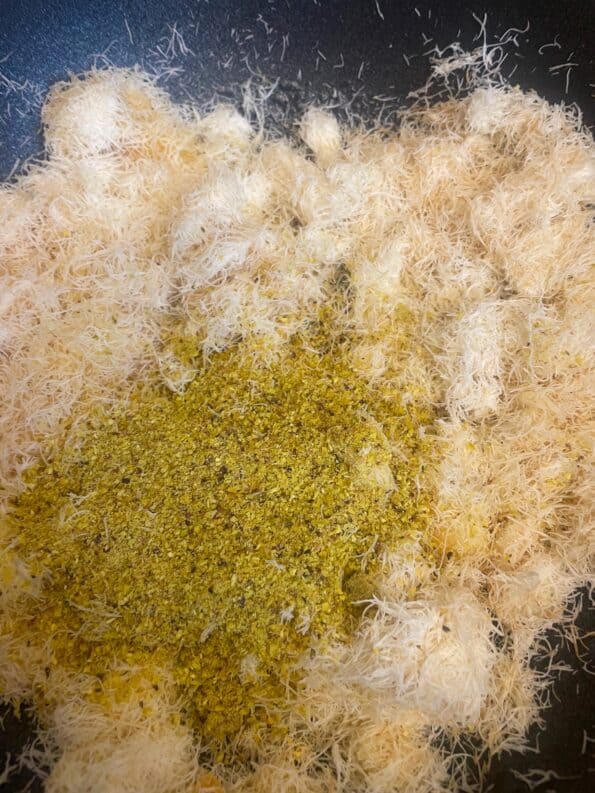 Pistachio added to kunafa in pot