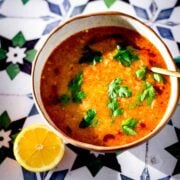 Ezogelin Soup in bowl with lemon to side