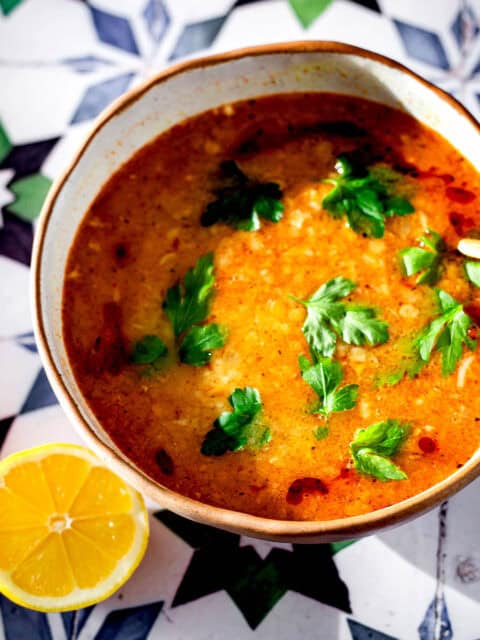 Ezogelin Soup in bowl with lemon to side