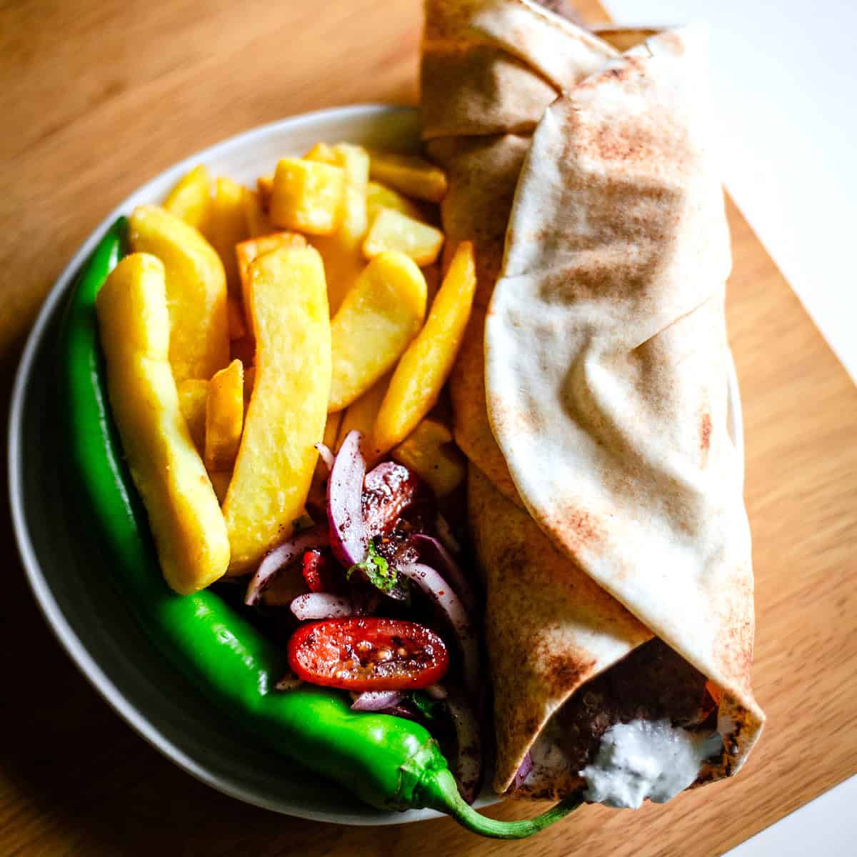 Doner Kebab, Chips and Salad in plate