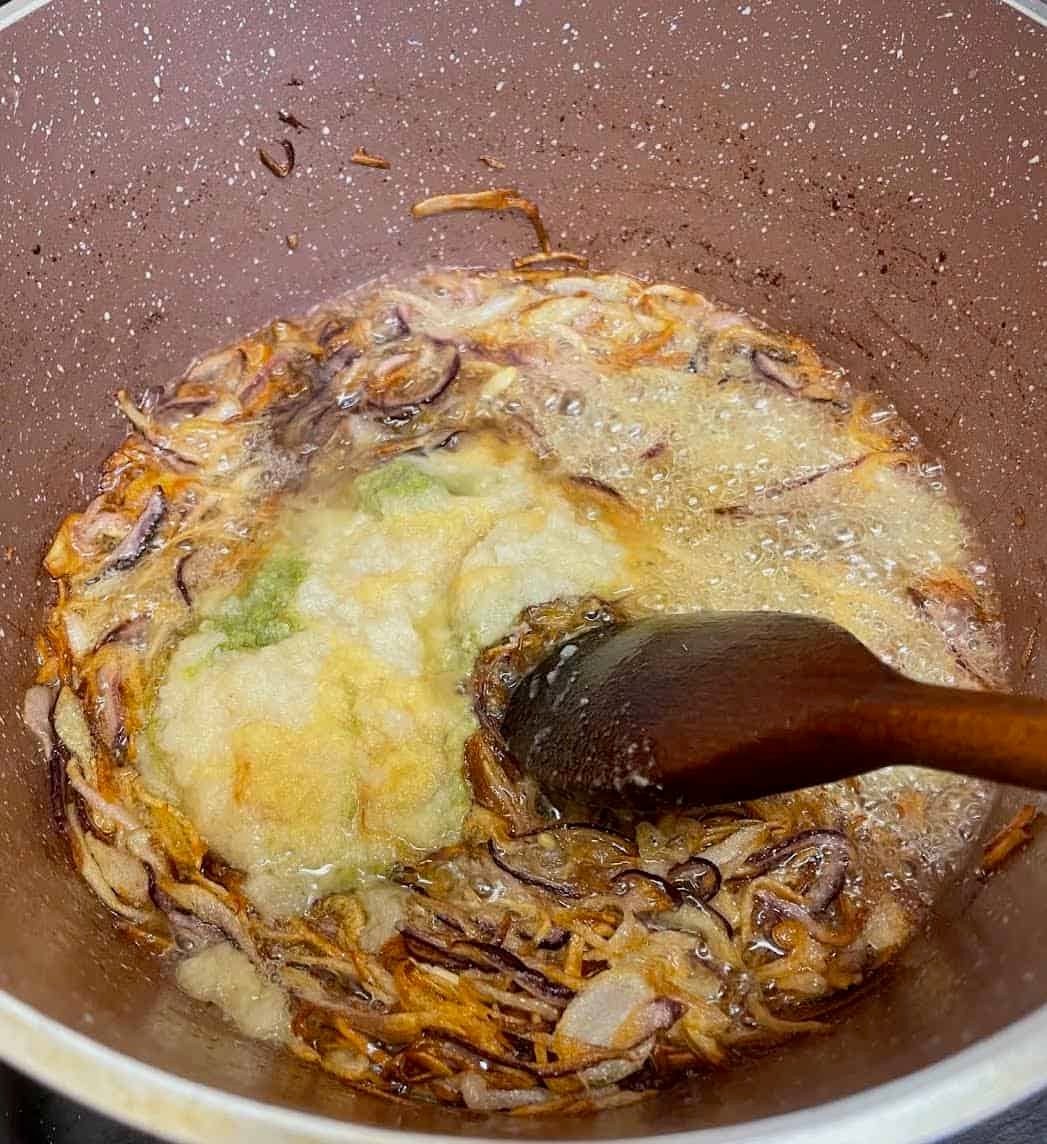 Authentic slow cooked Chicken Haleem Garlic, Ginger and Green Chilli added to pot