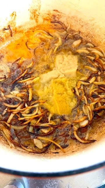 Authentic Pakistani Nihari (Slow-Cooked Lamb or Beef Nihari) Delicious seafood cooked with butter, garlic, and spices in a Tiffin and Tea dish.