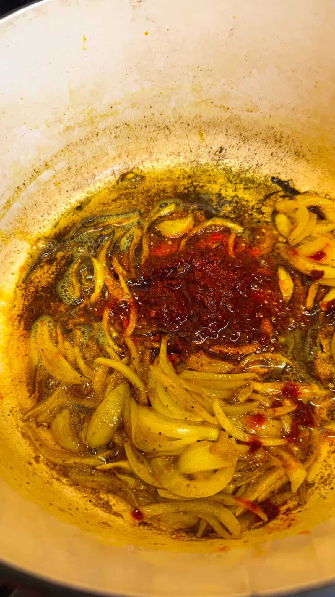 Moroccan Chicken with Preserved Lemon & Harissa Harissa added to pot