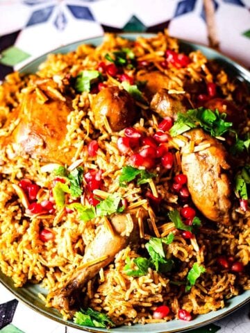 Kabsa in dish with toppings