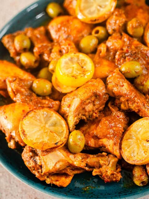 Chicken tagine in plate with lemons and olives