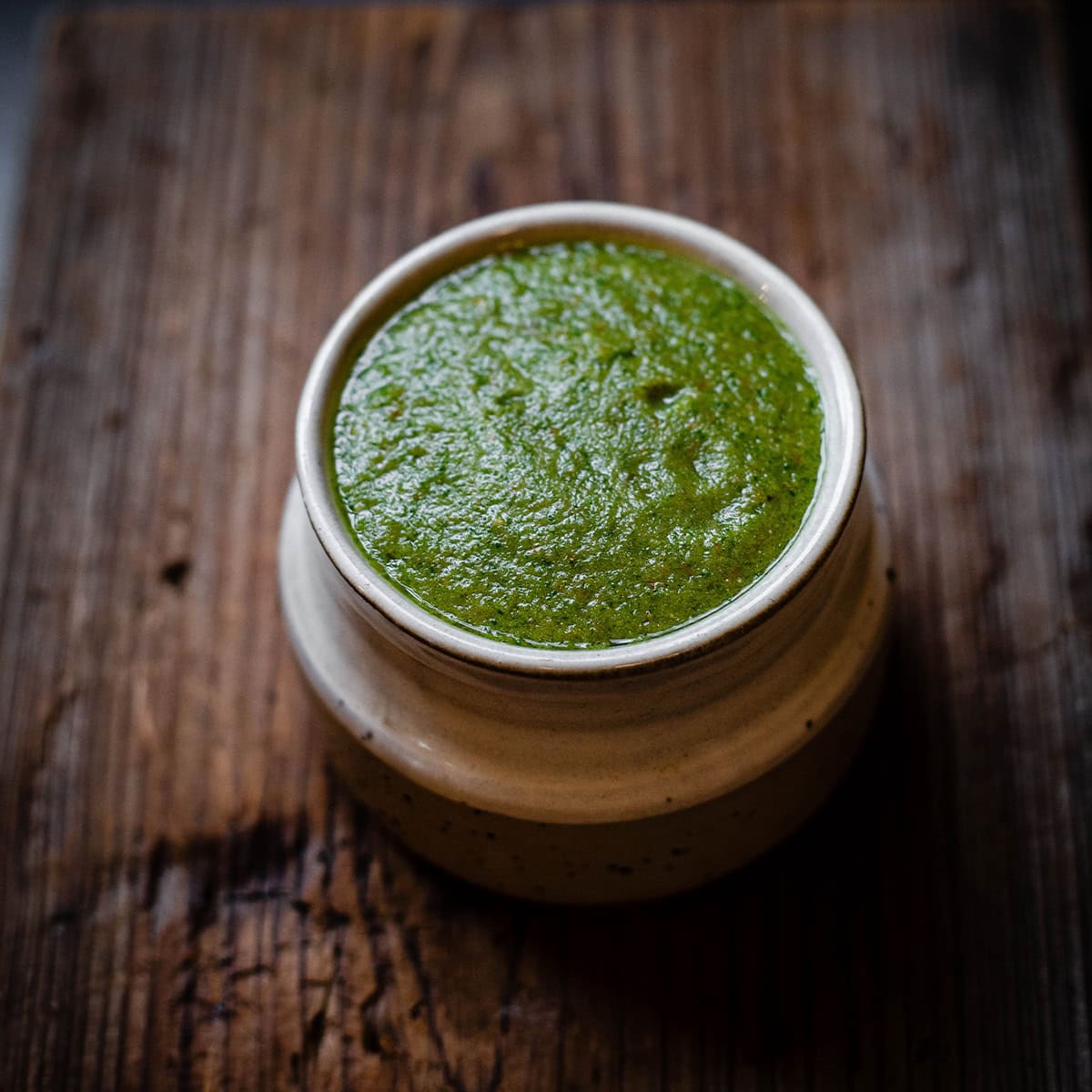 Zhug (Zhoug) Recipe – Authentic Yemeni Green Chili Sauce Zhug on table