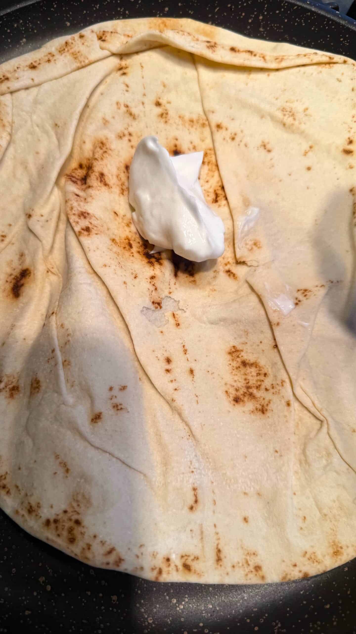 Crispy Chicken Shawarma Wrap with Toum and Pomegranate Molasses Shawarma wrap with toum on top