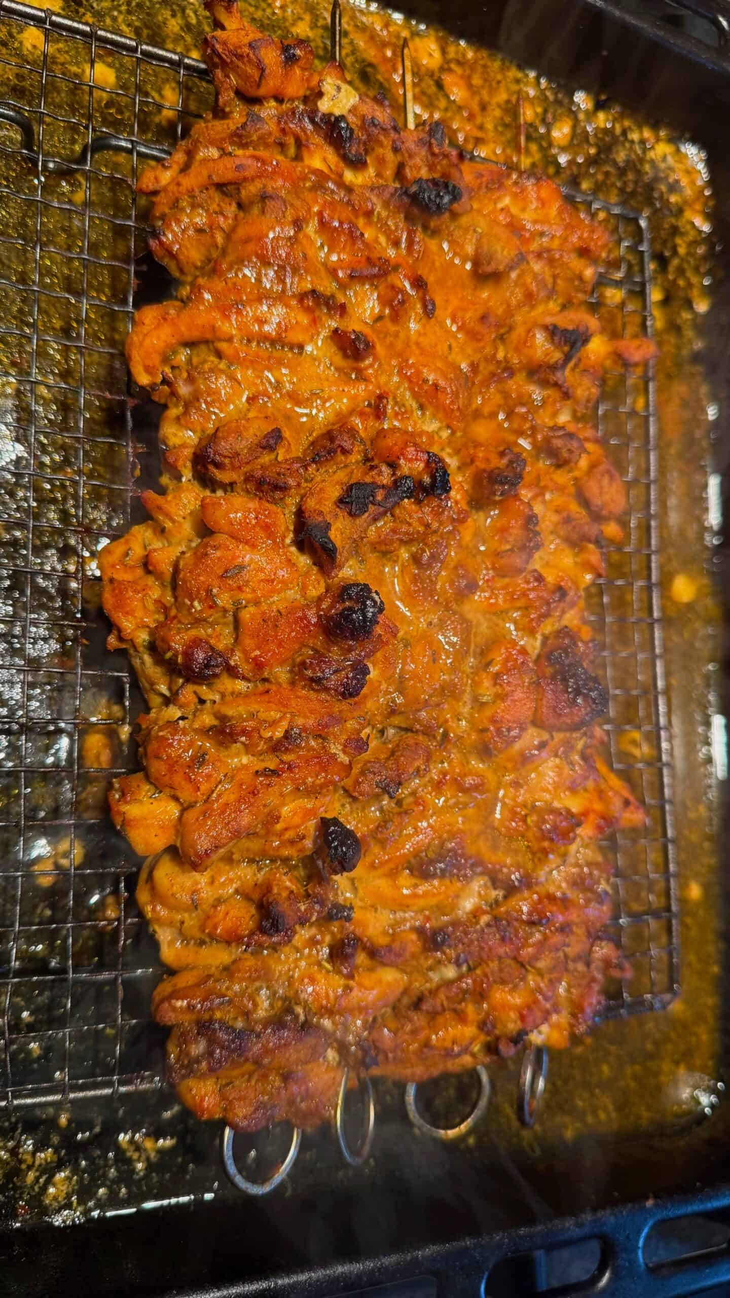 Crispy Chicken Shawarma Wrap with Toum and Pomegranate Molasses Cooked Chicken Skewers on rack