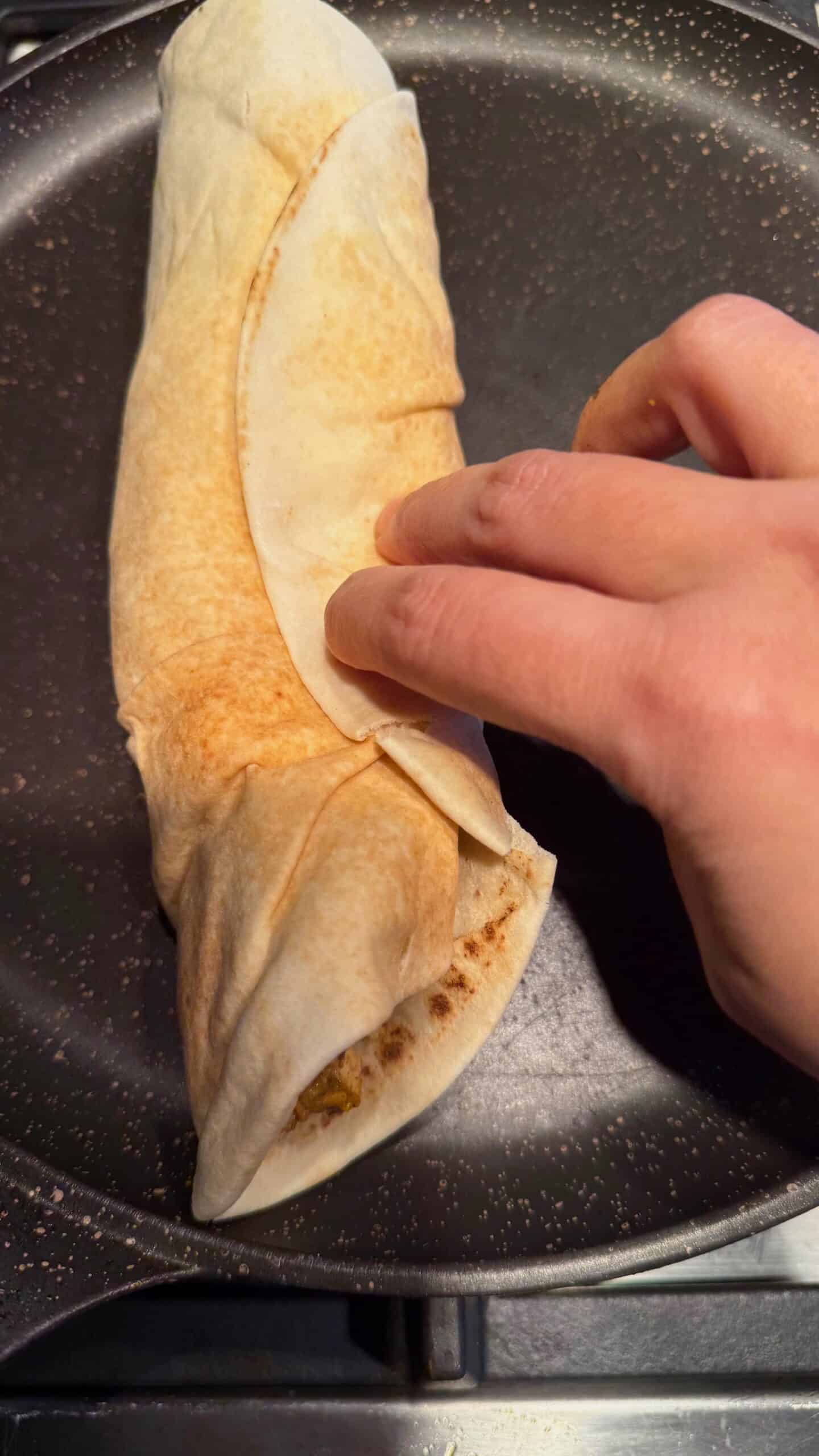 Crispy Chicken Shawarma Wrap with Toum and Pomegranate Molasses Wrap in pan