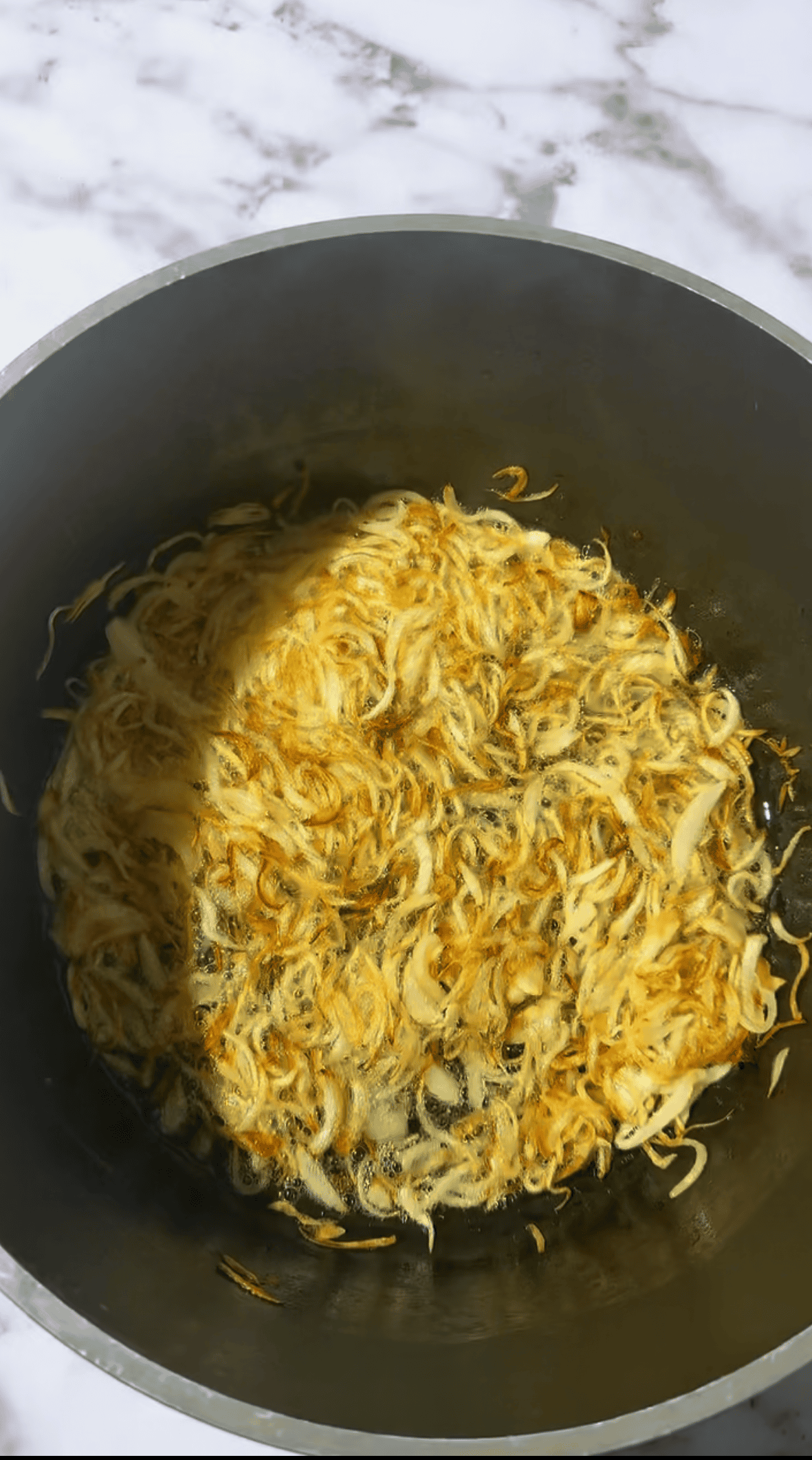 Memon Lamb (or Mutton) Akni Golden onions in pot