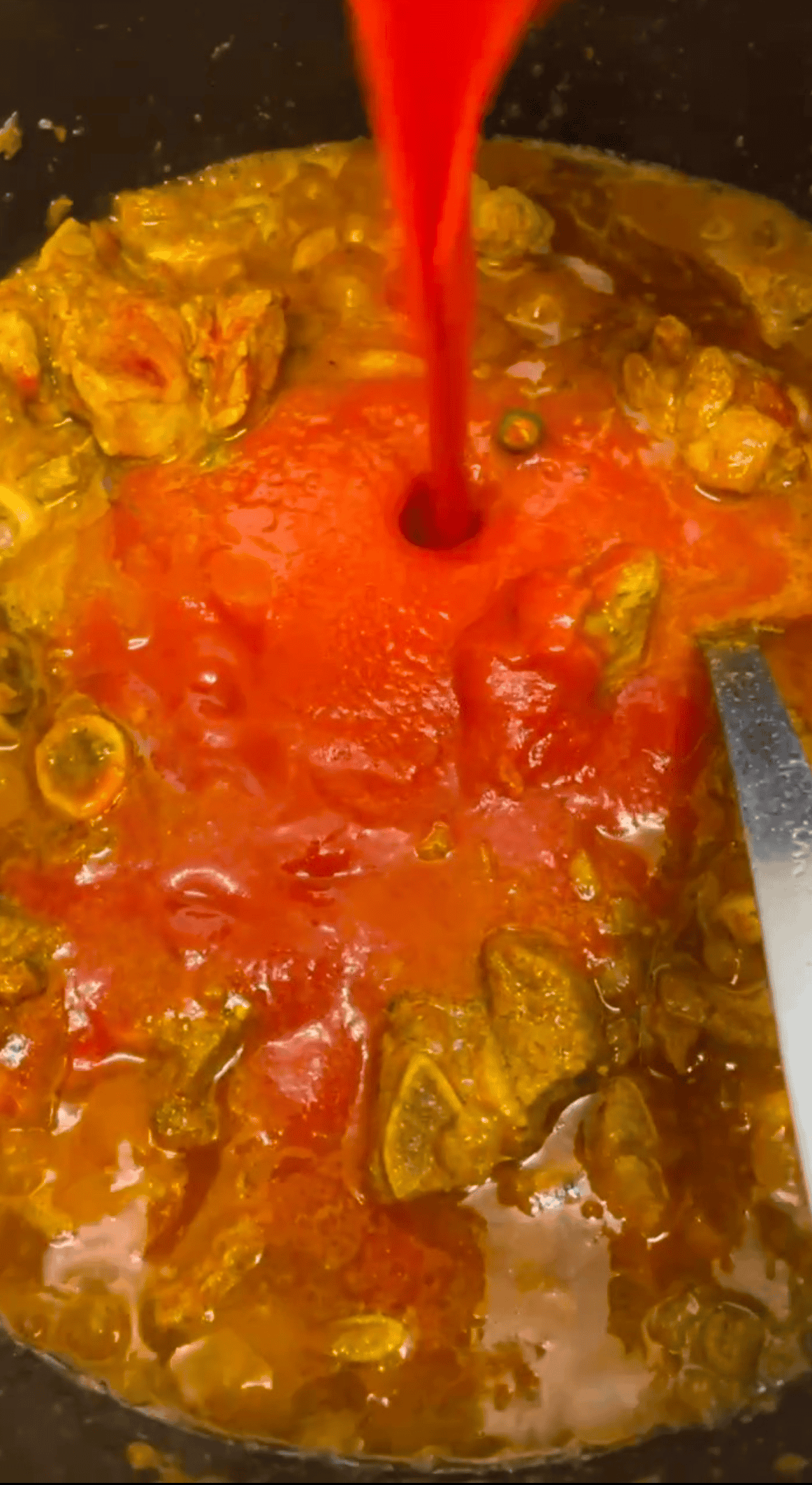 Memon Lamb (or Mutton) Akni Pureed tomatoes added to pot