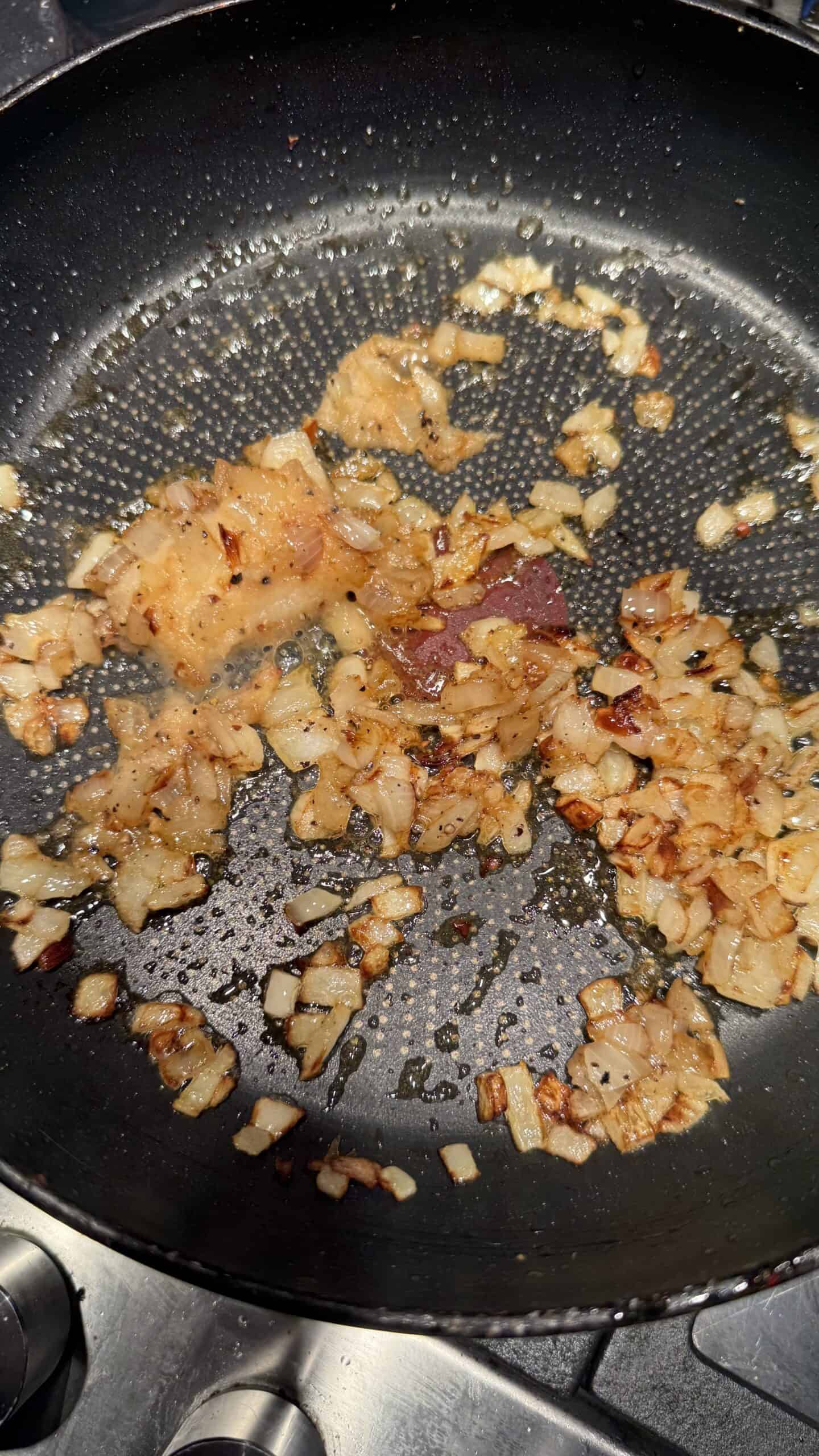 Lebanese Batata w Bayd – Potatoes and Eggs Caramalised Onion in pan