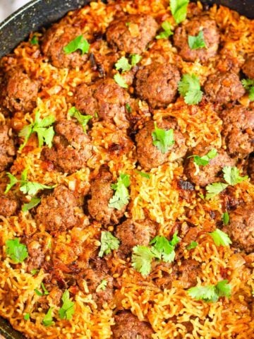 Seekh kebab meatballs and rice in pot
