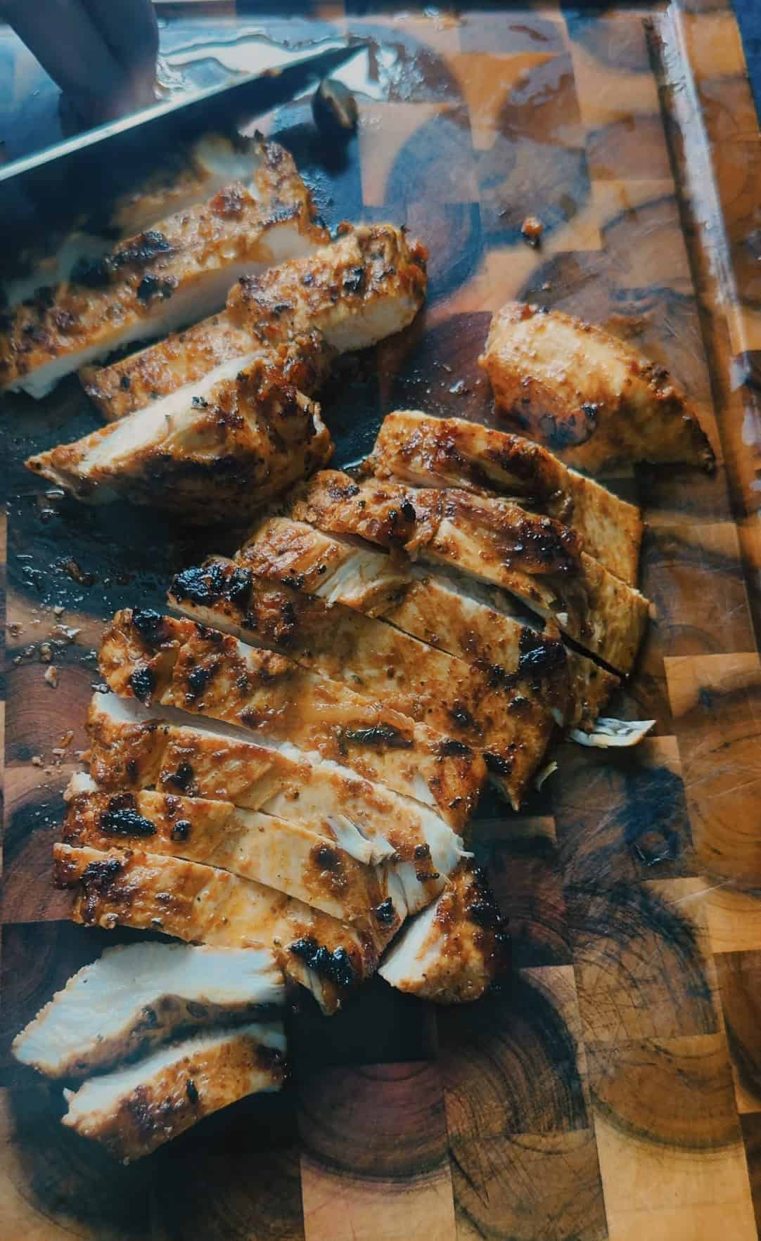 Chicken Doner Meal Prep with Mediterranean Yellow Rice Sliced Chicken on chopping board