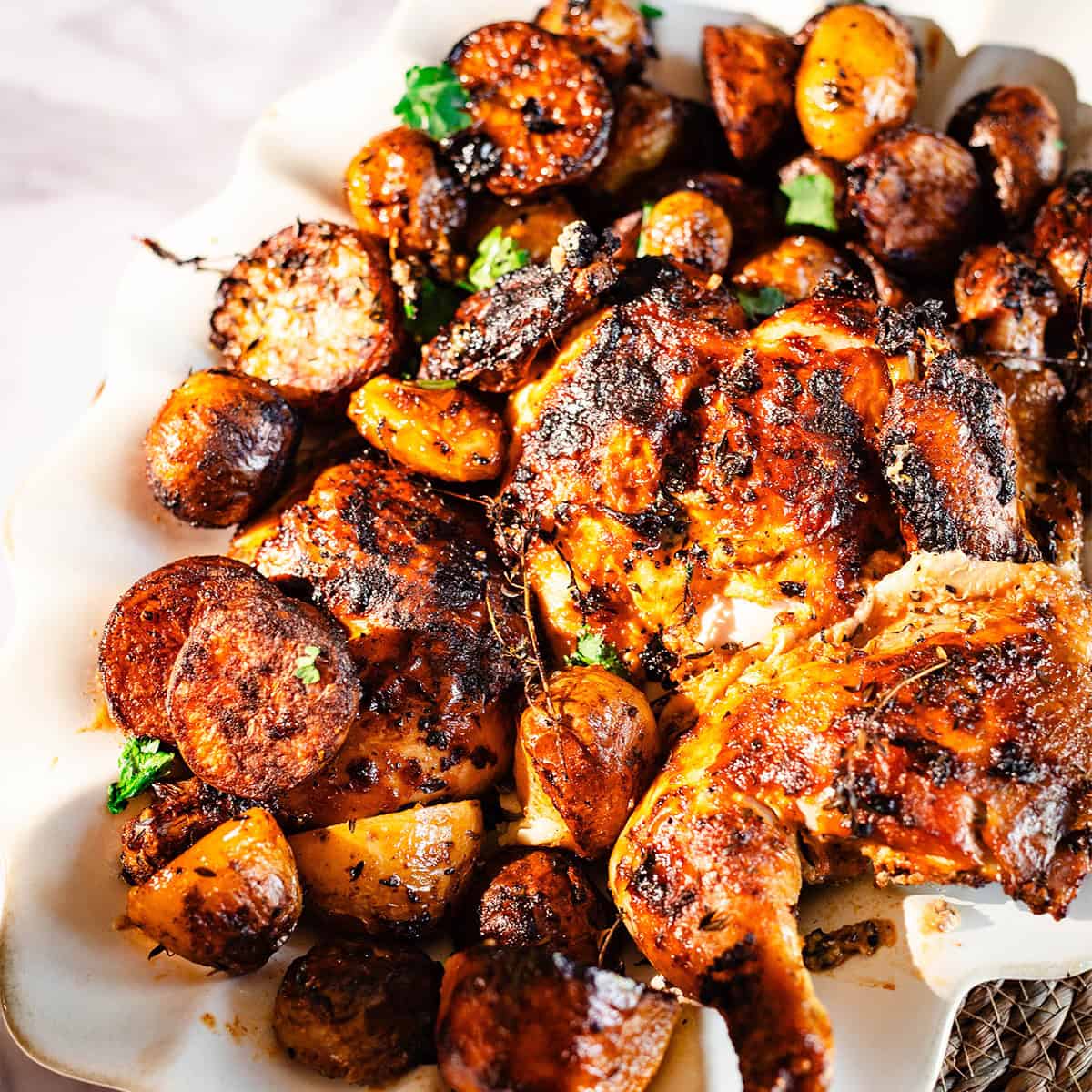 Lebanese Spatchcock Chicken Tray Bake with Baby Potatoes Lebanese Chicken and Potatoes in dish