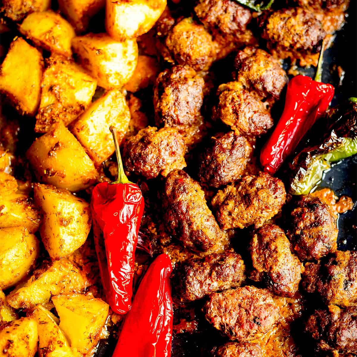 Turkish Köfte & Potato Traybake with Lemon Garlic Sauce Kofte and Potatoes in tin